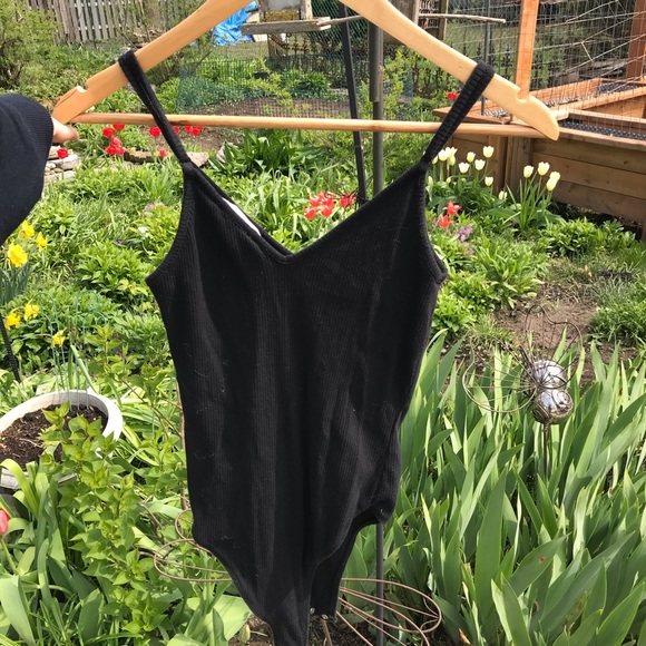 Black ribbed bodysuit with adjustable straps and soft v plunge neck. - Picture 2 of 5